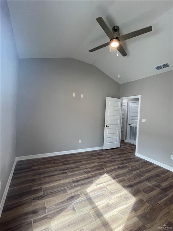 605 Sparrow Road Weslaco, TX 78596 - Photo 20 of 31 an empty room with wooden floor fan and windows