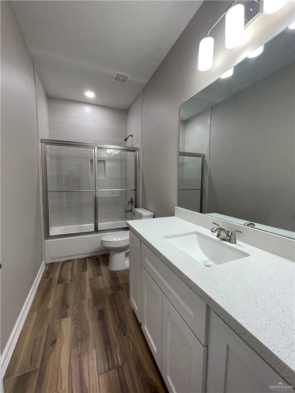 605 Sparrow Road Weslaco, TX 78596 - Photo 23 of 31 a bathroom with a sink a large mirror and a shower