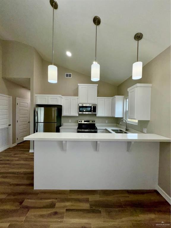 605 Sparrow Road Weslaco, TX 78596 - Photo 25 of 31 a view of kitchen with microwave and stove