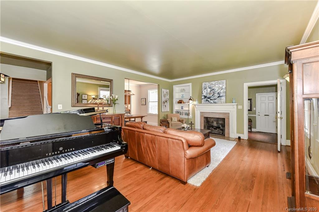 621 Westbury Road Charlotte, NC 28211 - Photo 2 of 45 a living room with furniture fireplace and a table