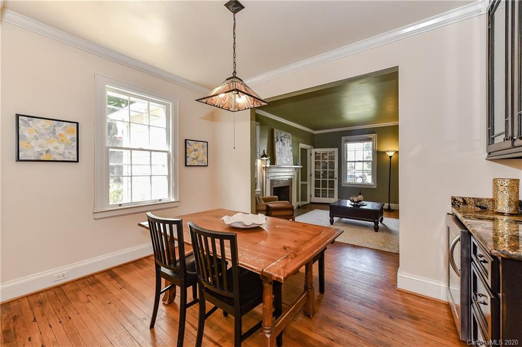621 Westbury Road Charlotte, NC 28211 - Photo 12 of 45 a view of a dining room with furniture window and wooden floor