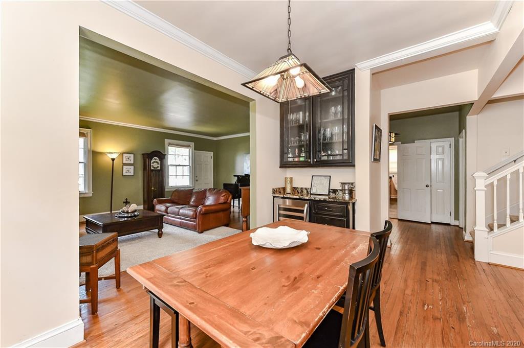 621 Westbury Road Charlotte, NC 28211 - Photo 13 of 45 a view of a dining room with furniture and wooden floor