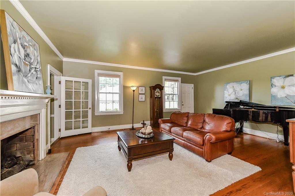 621 Westbury Road Charlotte, NC 28211 - Photo 14 of 45 a living room with furniture and a fireplace