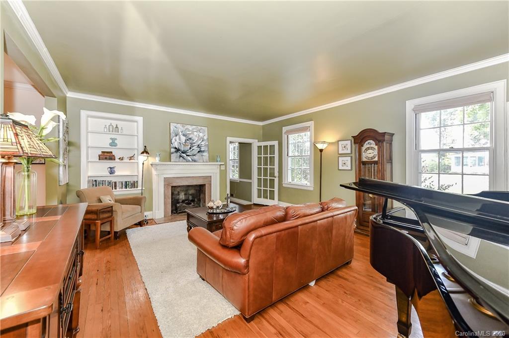 621 Westbury Road Charlotte, NC 28211 - Photo 15 of 45 a living room with furniture fireplace and flat screen tv