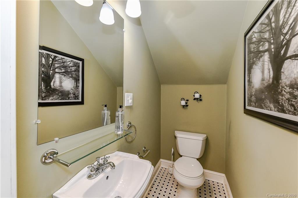 621 Westbury Road Charlotte, NC 28211 - Photo 20 of 45 a bathroom with a toilet sink and mirror