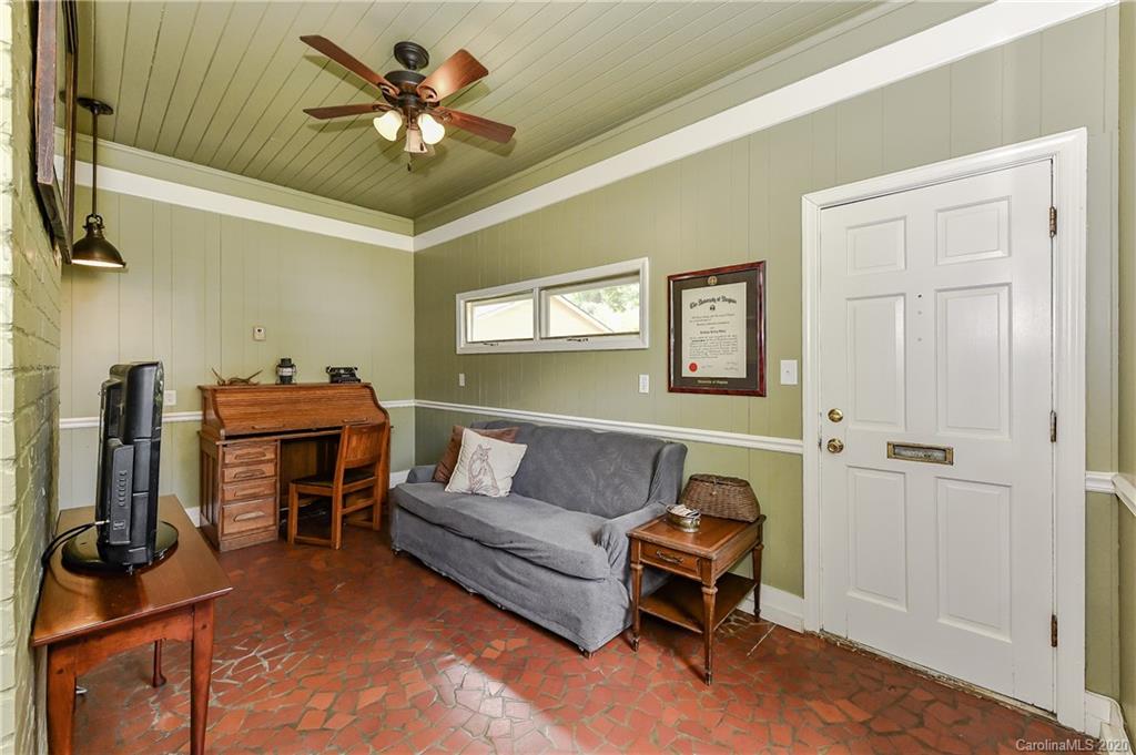 621 Westbury Road Charlotte, NC 28211 - Photo 3 of 45 a living room with furniture and a flat screen tv
