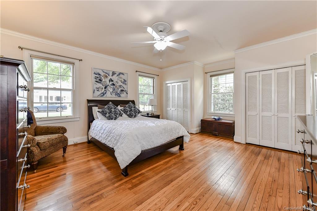 621 Westbury Road Charlotte, NC 28211 - Photo 23 of 45 a spacious bedroom with a bed and wooden floor