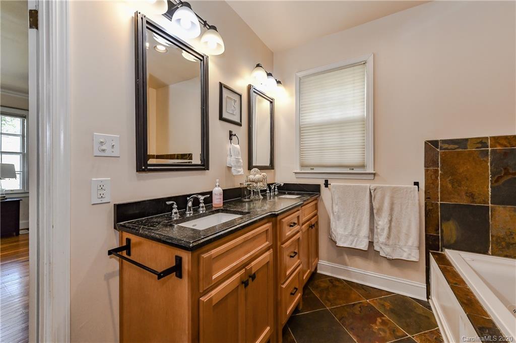 621 Westbury Road Charlotte, NC 28211 - Photo 24 of 45 a bathroom with a sink and a mirror