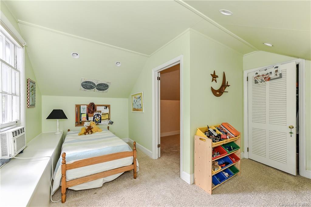 621 Westbury Road Charlotte, NC 28211 - Photo 27 of 45 a bedroom with a bed and a window