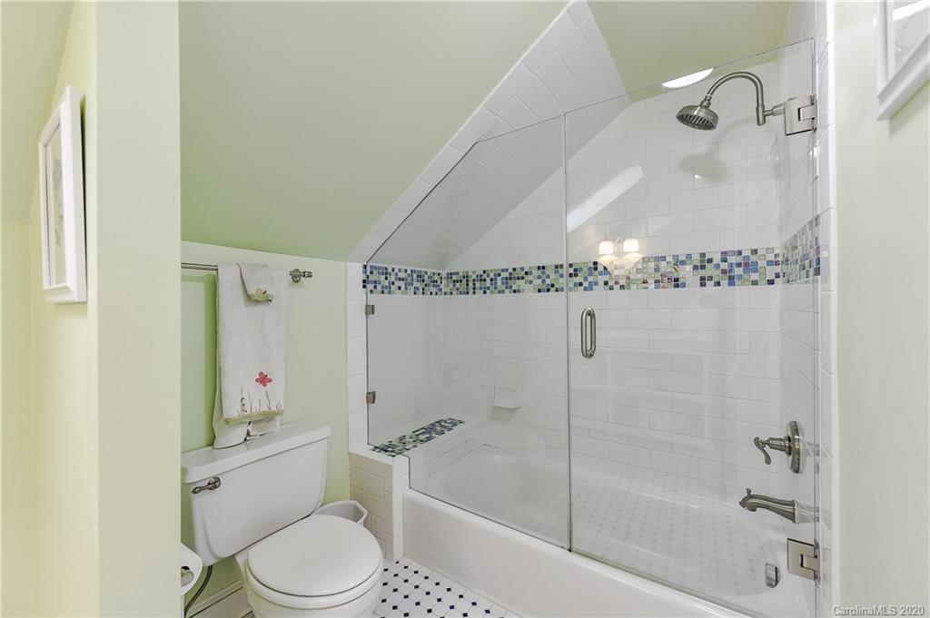 621 Westbury Road Charlotte, NC 28211 - Photo 31 of 45 a bathroom with a bathtub a toilet and a shower