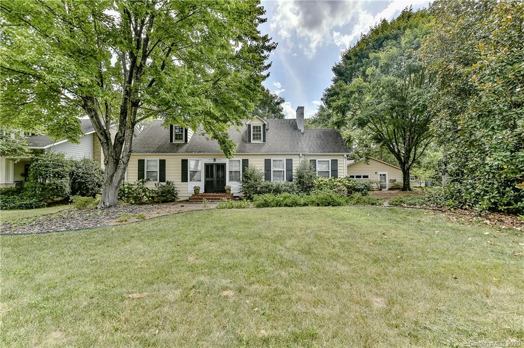 621 Westbury Road Charlotte, NC 28211 - Photo 42 of 45 a front view of a house with a yard and trees