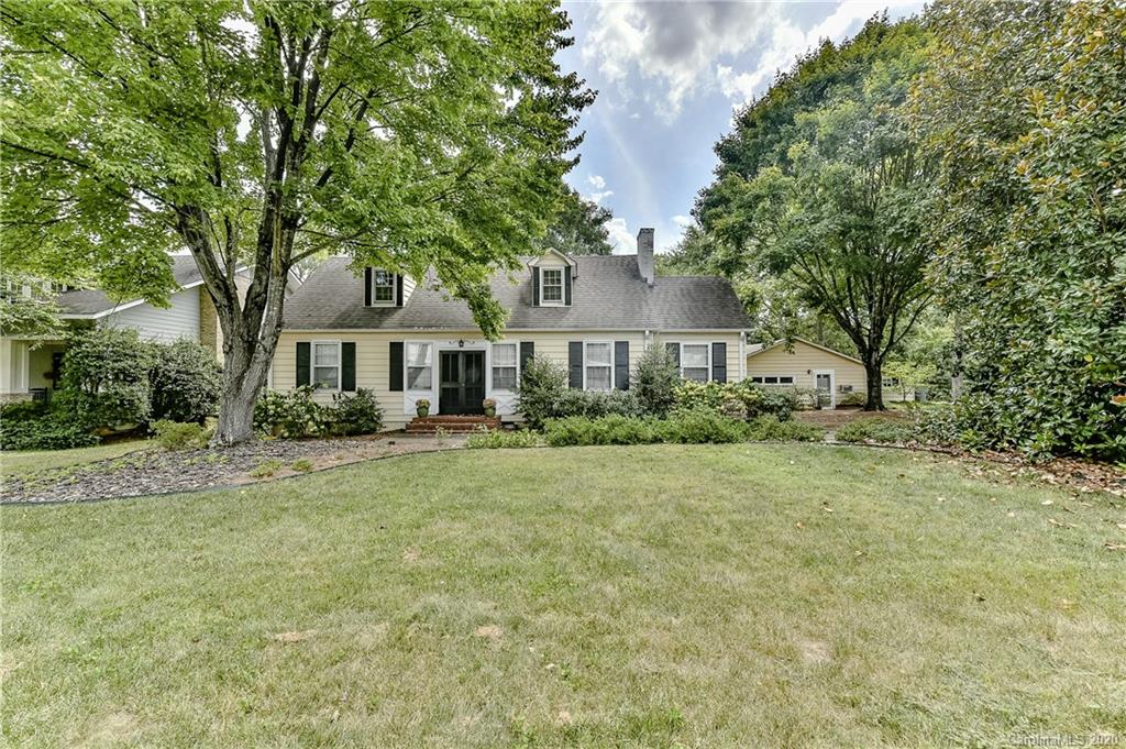 621 Westbury Road Charlotte, NC 28211 - Photo 43 of 45 a front view of a house with a yard and trees