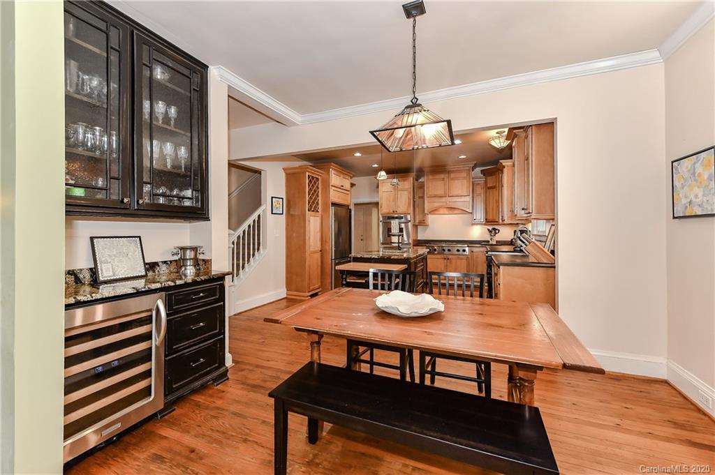 621 Westbury Road Charlotte, NC 28211 - Photo 6 of 45 a view of a dining room with furniture a chandelier and wooden floor