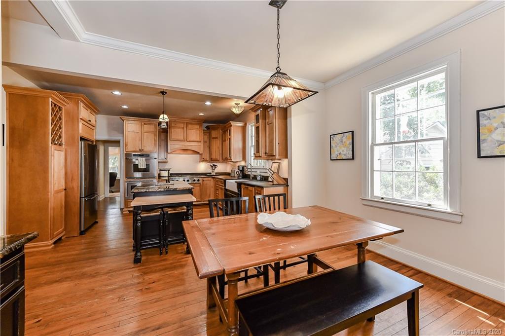 621 Westbury Road Charlotte, NC 28211 - Photo 7 of 45 a view of a dining room with furniture window and wooden floor