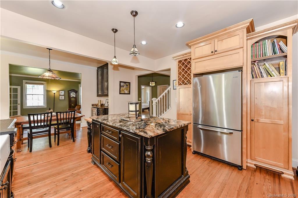 621 Westbury Road Charlotte, NC 28211 - Photo 10 of 45 a kitchen with stainless steel appliances granite countertop a refrigerator a stove and a wooden floors