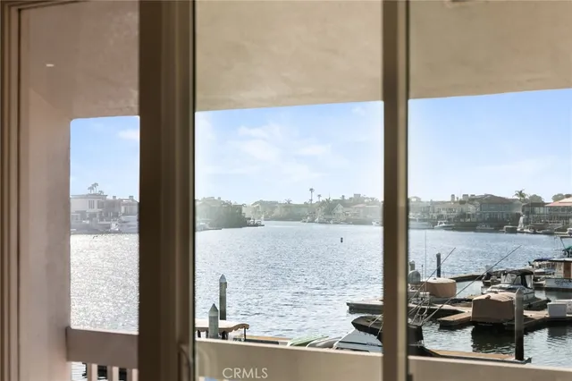 a view of a balcony with chairs and ocean view