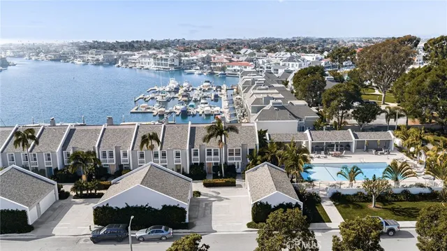 an aerial view of a house with a lake view