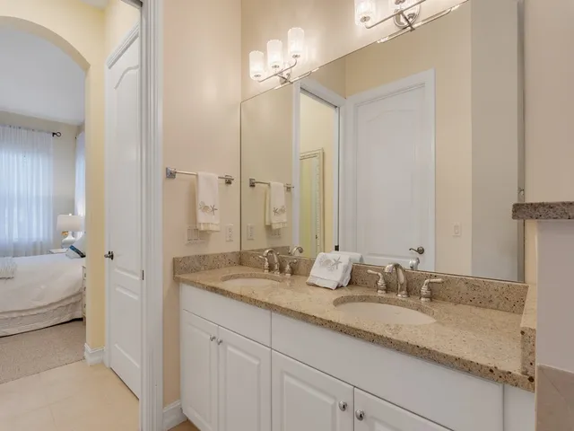 a bathroom with a sink double vanity and a mirror