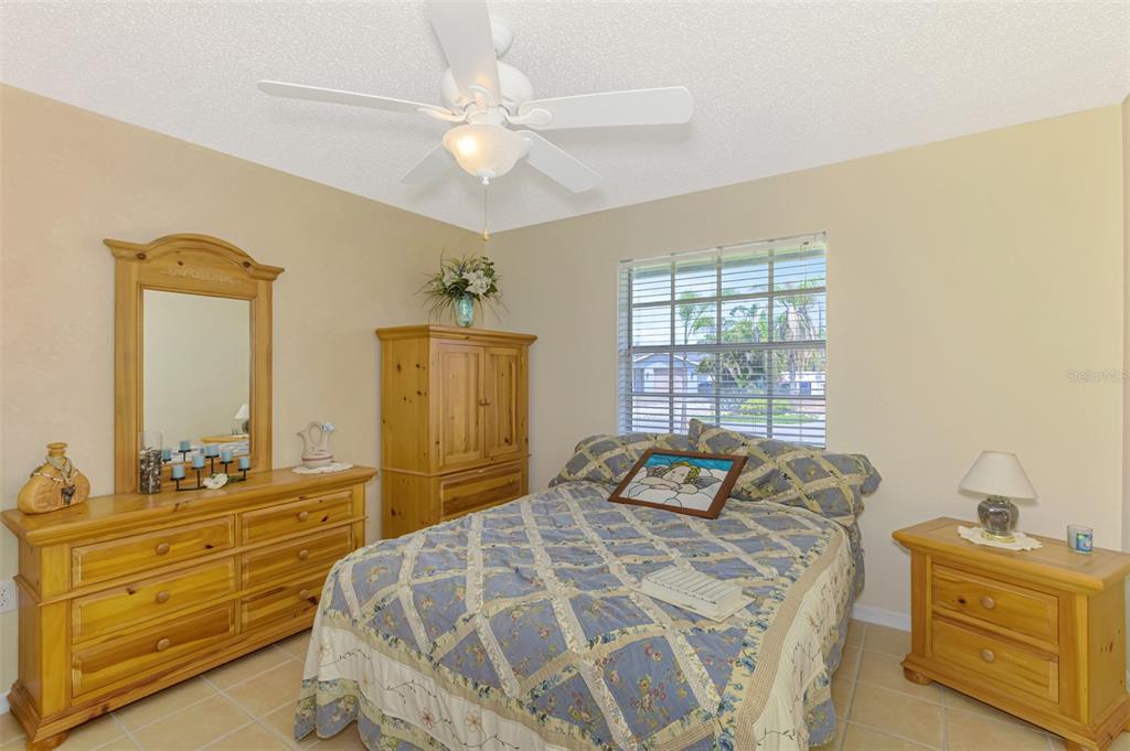 1137 Ponderosa Road Venice, FL 34293 - Photo 32 of 48 a bedroom with a bed and a window