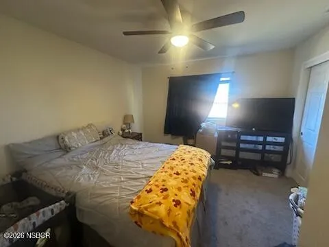 a bathroom with a sink and mirror with toilet