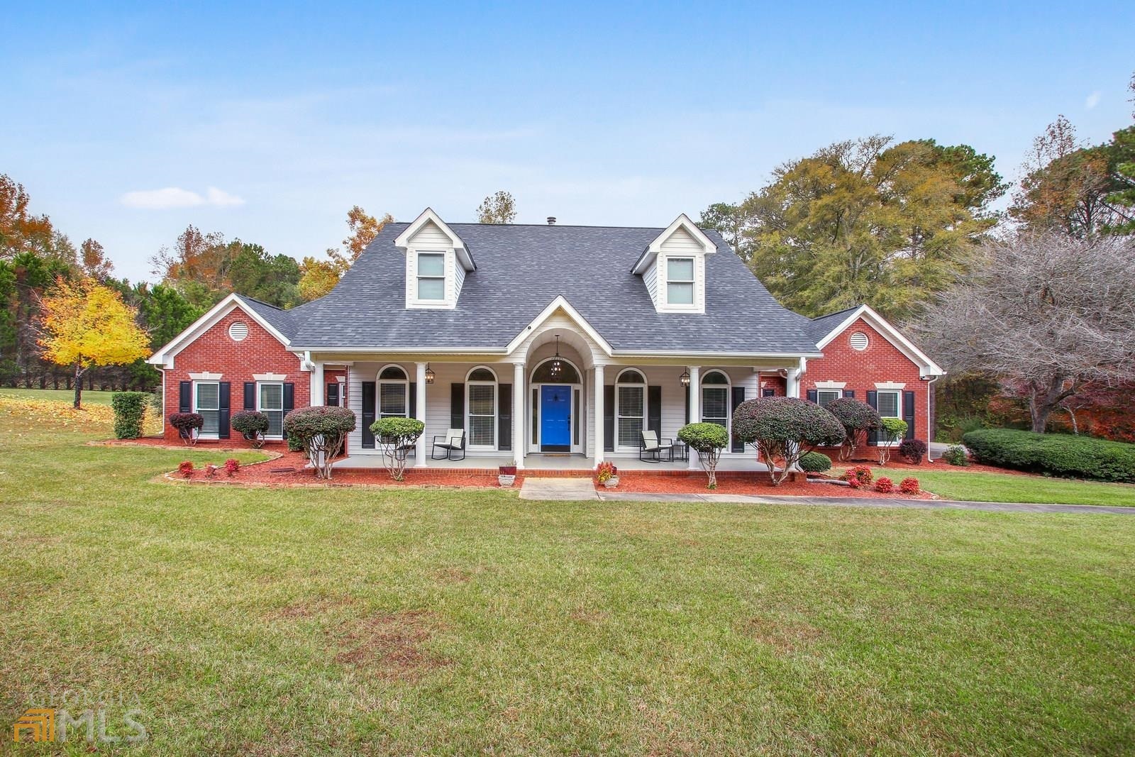 236 Camp Ground Road Griffin, GA 30223 - Photo 1 of 1 a front view of a house with garden