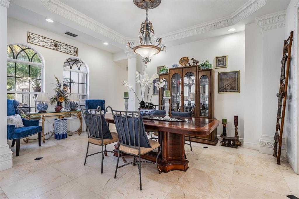 10628 Pontofino Circle Trinity, FL 34655 - Photo 11 of 75 a view of a livingroom with furniture and a chandelier