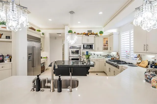 a living room with furniture fireplace and a large window