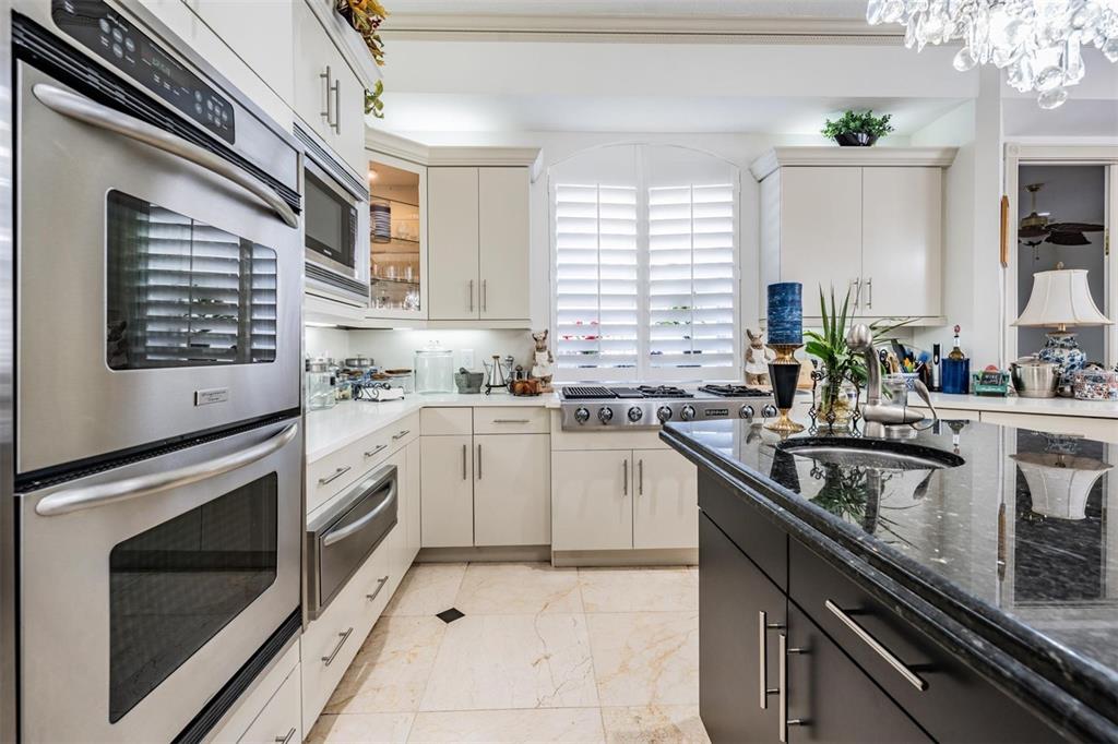 10628 Pontofino Circle Trinity, FL 34655 - Photo 15 of 75 a kitchen with granite countertop stainless steel appliances sink stove and cabinets