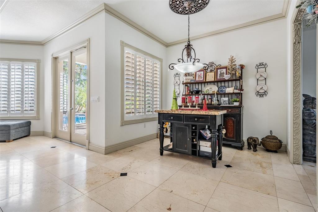10628 Pontofino Circle Trinity, FL 34655 - Photo 19 of 75 a dining room with furniture and a chandelier