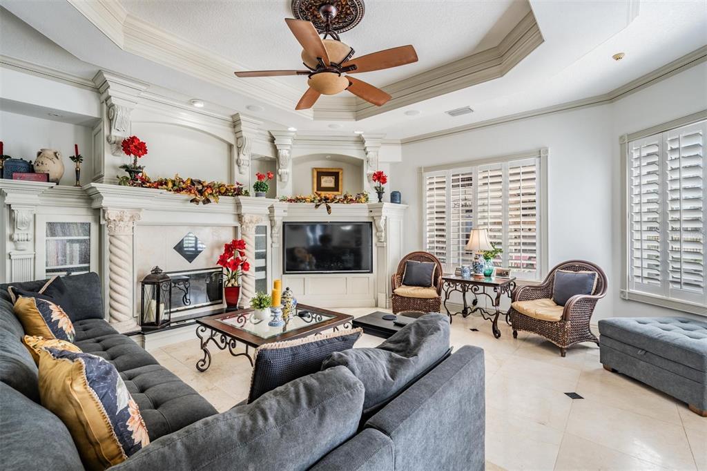 10628 Pontofino Circle Trinity, FL 34655 - Photo 22 of 75 a living room with furniture fireplace and a window
