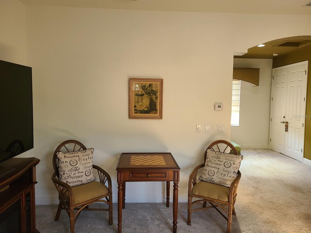 10628 Pontofino Circle Trinity, FL 34655 - Photo 28 of 75 a view of a workspace with furniture and a flat screen tv