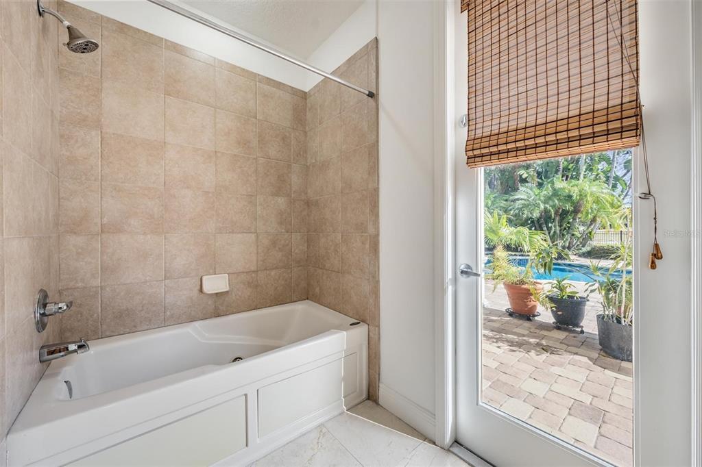 10628 Pontofino Circle Trinity, FL 34655 - Photo 38 of 75 a bath room with a bath tub and a shower