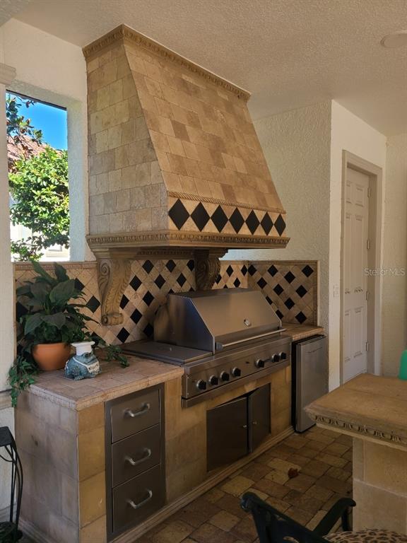 10628 Pontofino Circle Trinity, FL 34655 - Photo 46 of 75 a kitchen with a stove and a shower