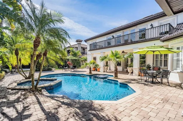 a view of a swimming pool with a lounge chairs