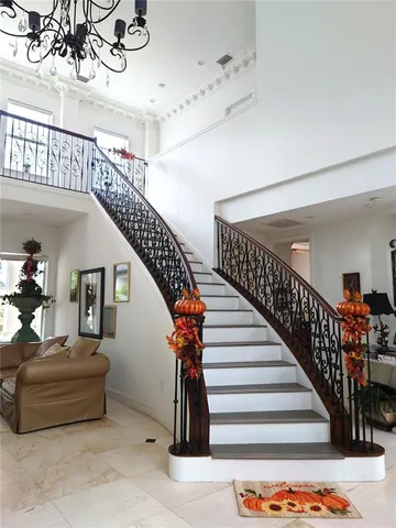 a kitchen with granite countertop stainless steel appliances sink stove and cabinets