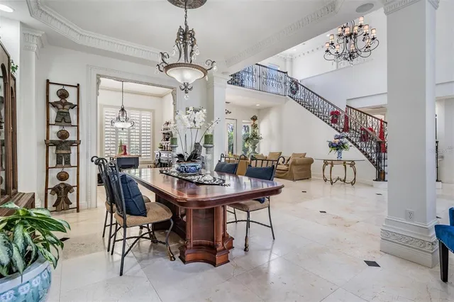 a kitchen with kitchen island granite countertop a sink counter top space appliances and cabinets