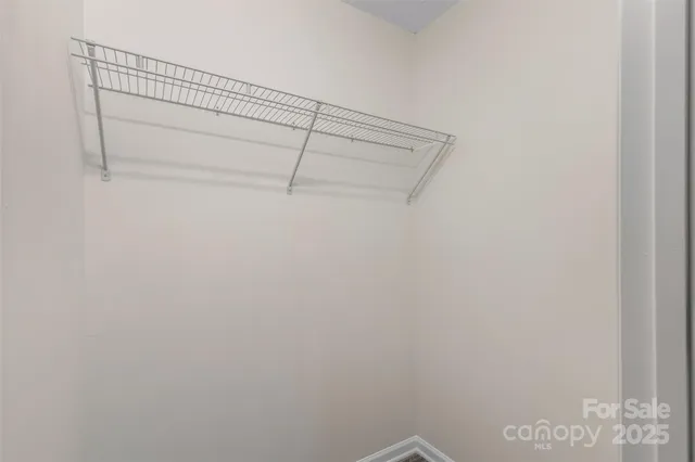 a view of a room with racks on the wall