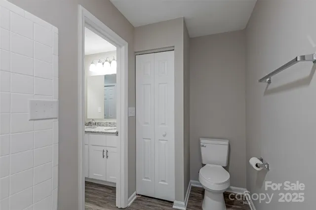 a bathroom with a toilet sink and shower