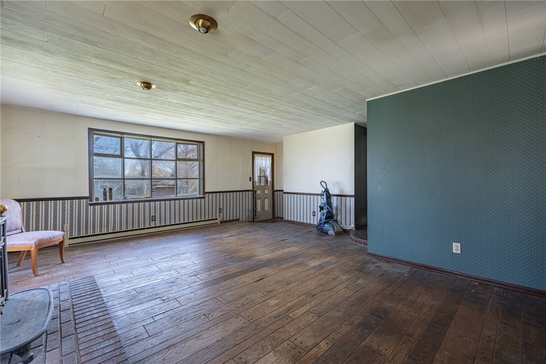 6885 Garber Road Clayton, OH 45415 - Photo 18 of 24 This expansive room offers abundant natural light and ample space for versatile living arrangements.
