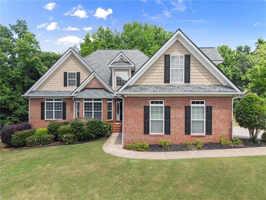 6643 Windvane Point Clermont, GA 30527 - Photo 1 of 88 a front view of a house with a yard