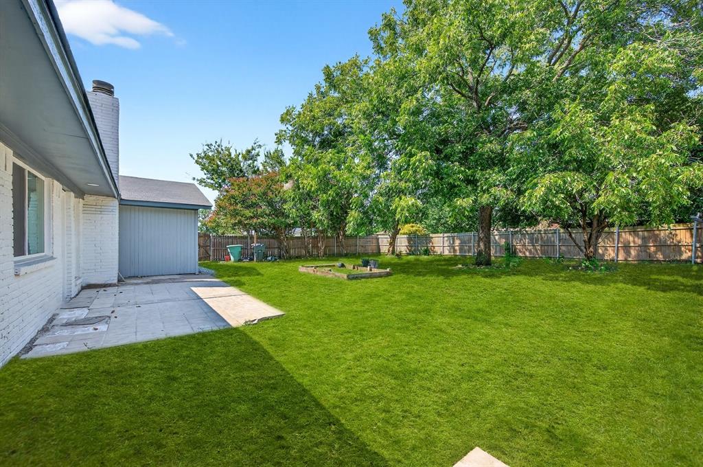 1401 La Salle Drive Sherman, TX 75090 - Photo 20 of 24 a view of a backyard with a garden