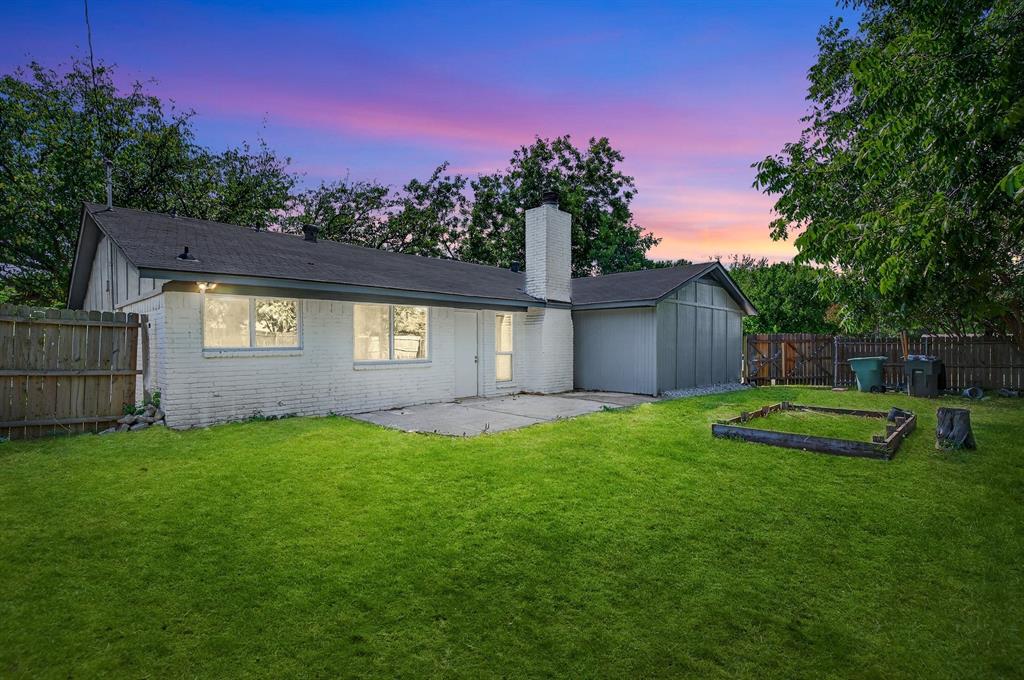 1401 La Salle Drive Sherman, TX 75090 - Photo 22 of 24 a view of a backyard with a garden