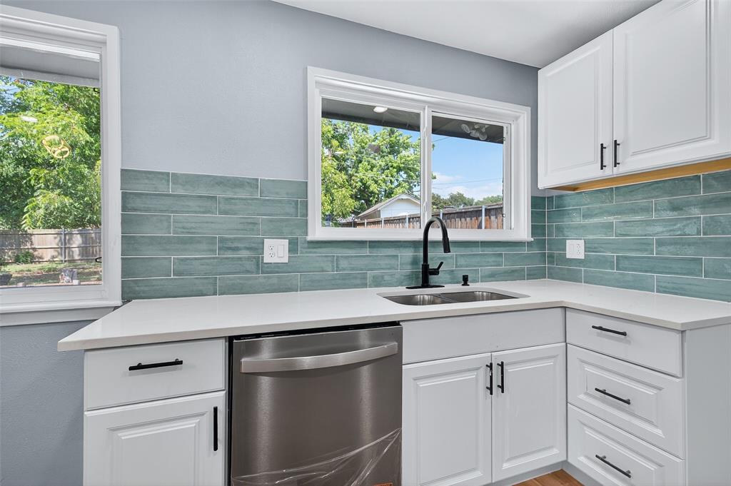 1401 La Salle Drive Sherman, TX 75090 - Photo 8 of 24 a kitchen with white cabinets and a window