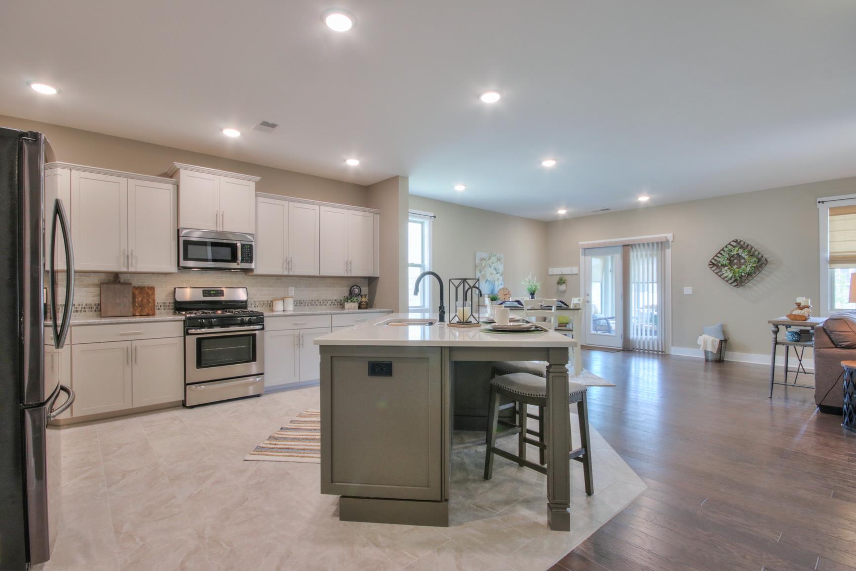 6419 Birchtree Drive Murfreesboro, TN 37128 - Photo 2 of 19 Open kitchen flows into living and breakfast nook.
