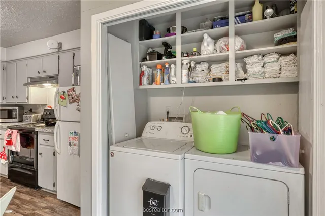 a utility room with washer and dryer