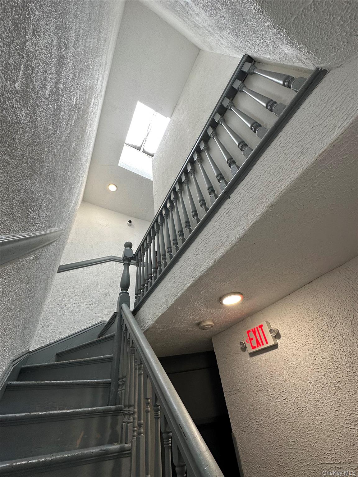 31 Victor Street Yonkers, NY 10701 - Photo 8 of 11 Stairway featuring a textured wall and recessed lighting