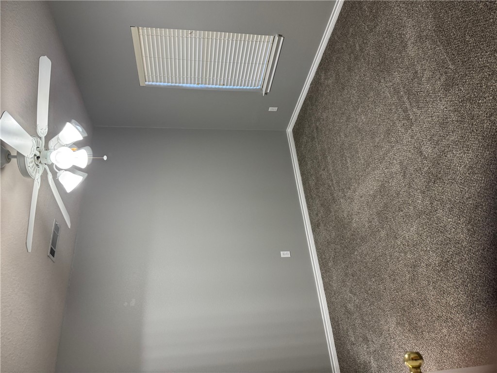 206 Fraternity Row College Station, TX 77845 - Photo 6 of 18 an empty room with a window and a fan
