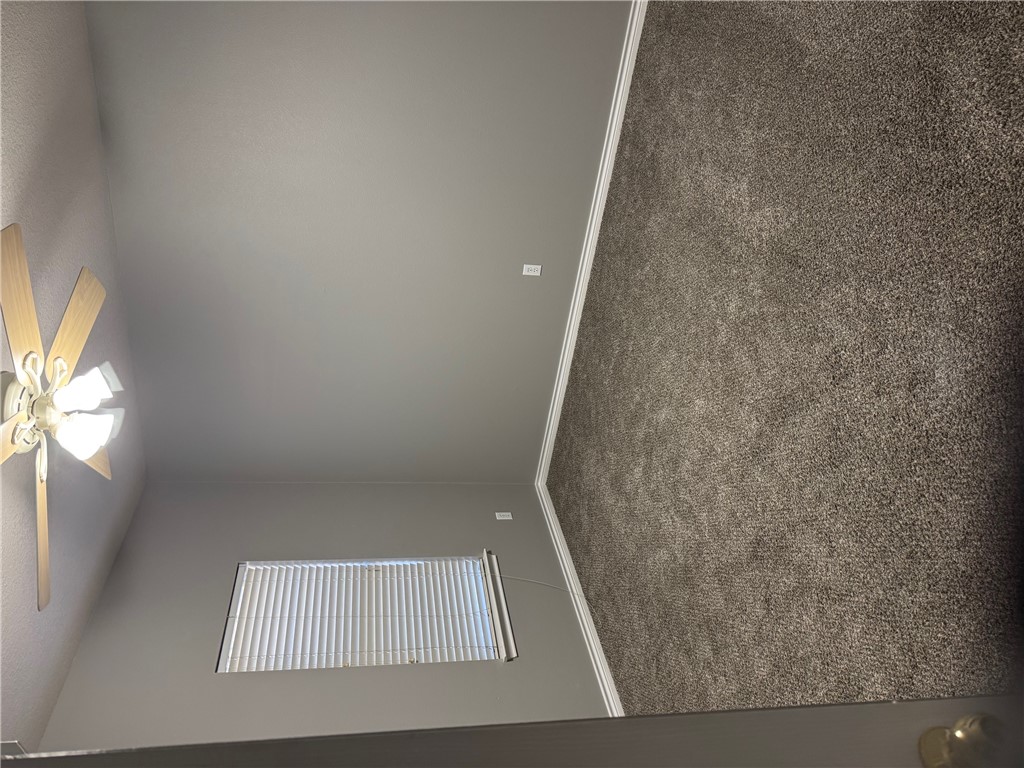 206 Fraternity Row College Station, TX 77845 - Photo 7 of 18 an empty room with windows and fan