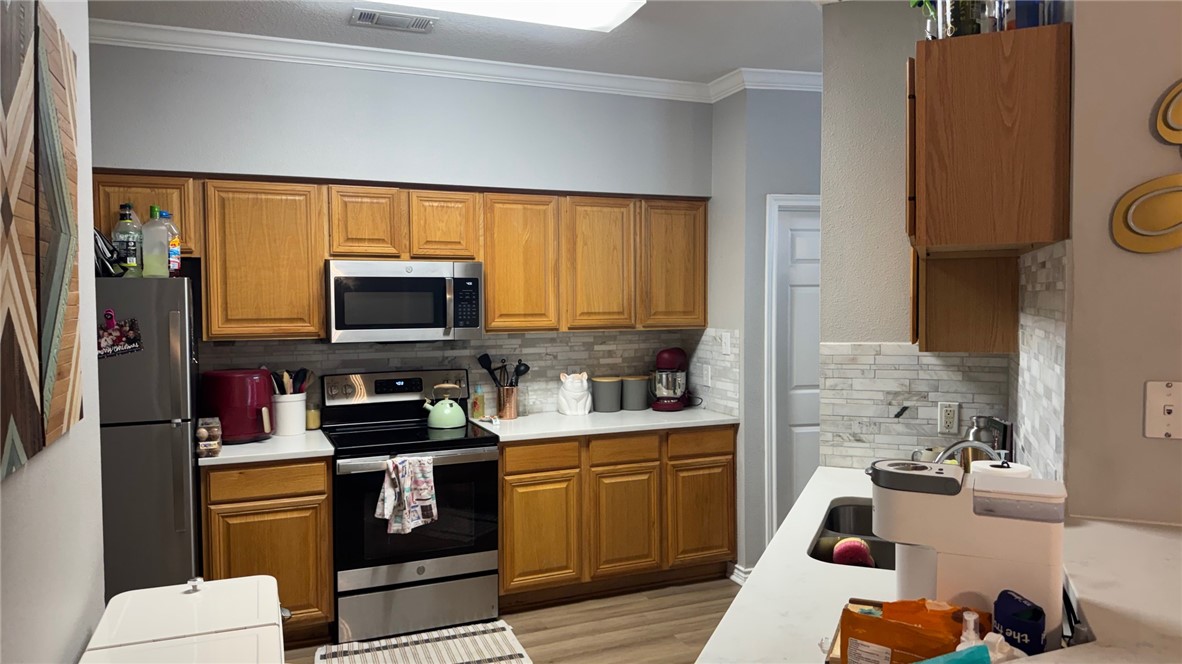 206 Fraternity Row College Station, TX 77845 - Photo 8 of 18 a kitchen with a sink stove and microwave