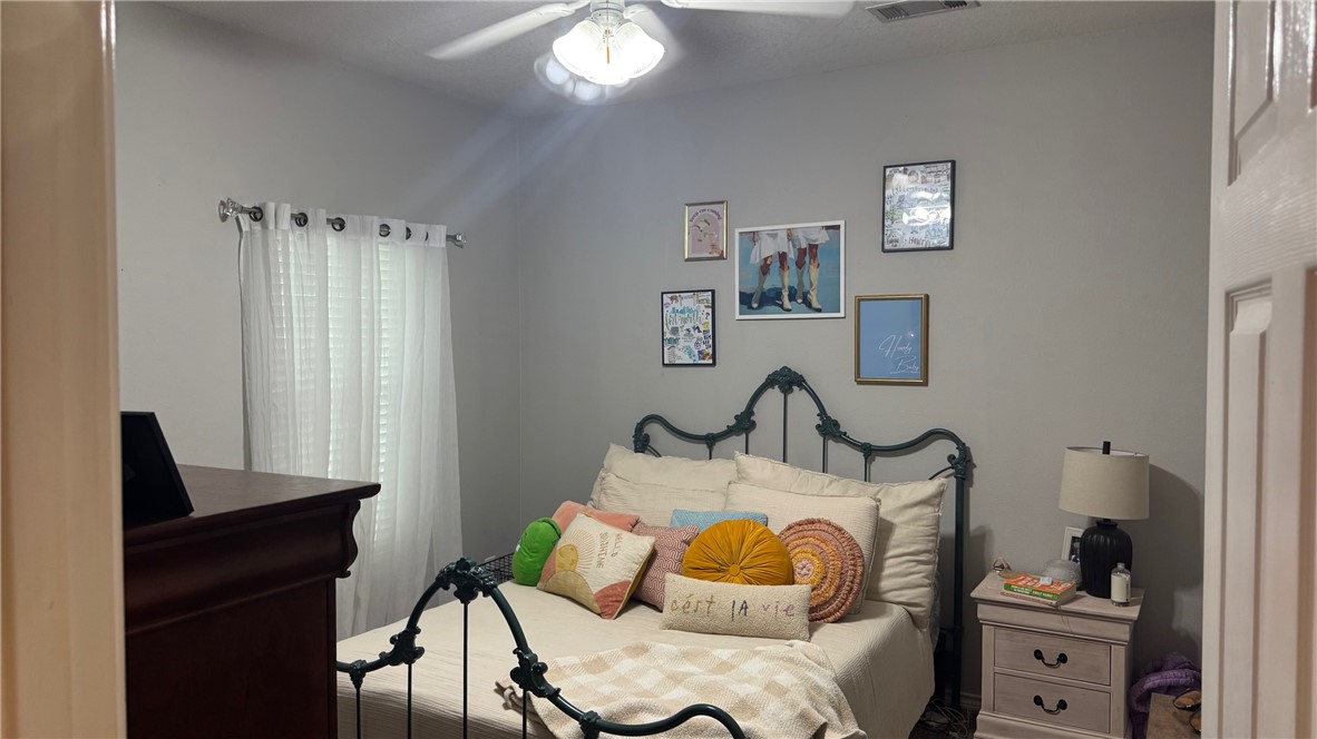 206 Fraternity Row College Station, TX 77845 - Photo 18 of 18 a bedroom with furniture and a window